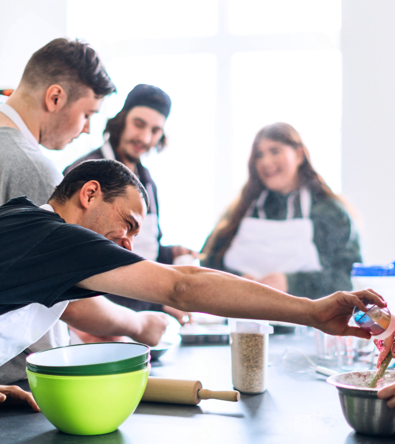 men in a cooking class